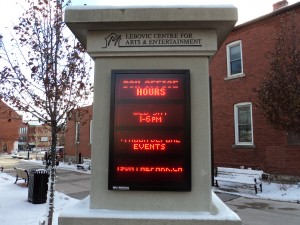 Modern sign located in front of the clock tower to attract pedestrian attention. Photo Credit: Robyn Verley
